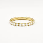 Yellow gold eternity ring with 2.3mm diamonds on a white background