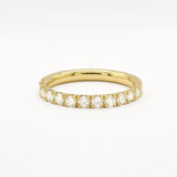 Yellow gold eternity ring with 2.3mm diamonds on a white background