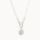 Silver chunky necklace with an handwriting engraved pendant on a white background