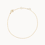 Gold hayseed bracelet on a white background