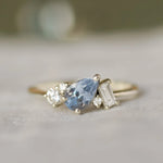 engagement ring with pear blue sapphire and diamonds