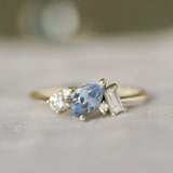 engagement ring with pear blue sapphire and diamonds