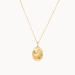 Gold leo necklace with an oval pendant on a white background