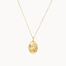 Gold leo necklace with an oval pendant on a white background