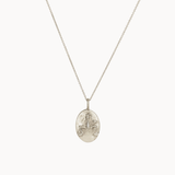 Silver libra necklace with an oval pendant on a white background