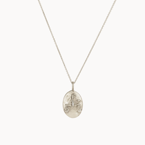 Silver libra necklace with an oval pendant on a white background
