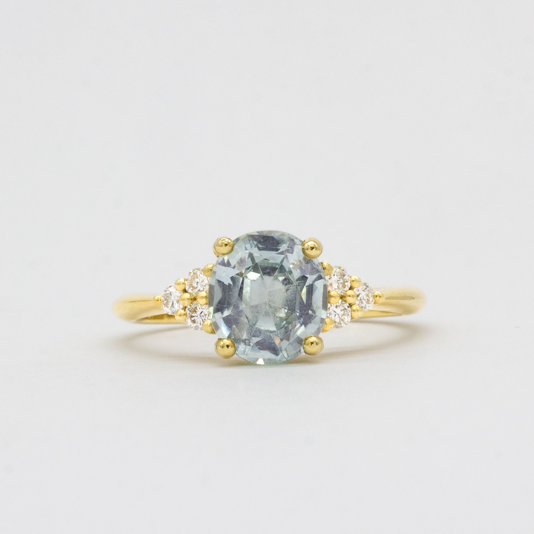 Light Blue Sapphire Engagement Ring With Cluster Diamonds