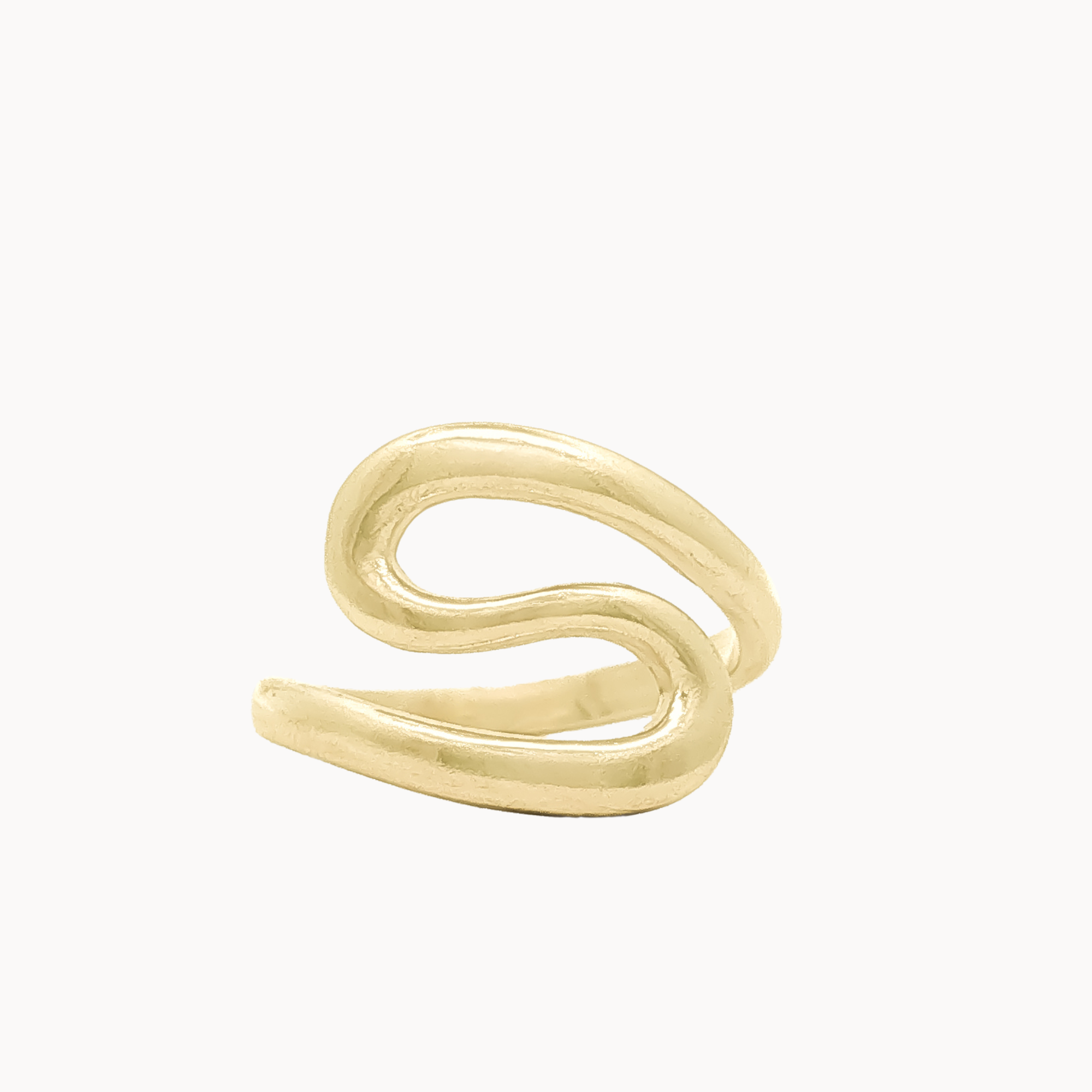 A gold s-shaped curve ring with a thick, organic, wavy tubular shape, photographed on a clean off-white background.