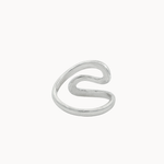 Back view of a minimalist silver open ring with a wavy, flowing S-shaped design, photographed on a clean, solid off-white background.
