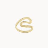 Back view of a gold wrap ring with a wavy, organic S-shaped design, shown on a plain off-white background.