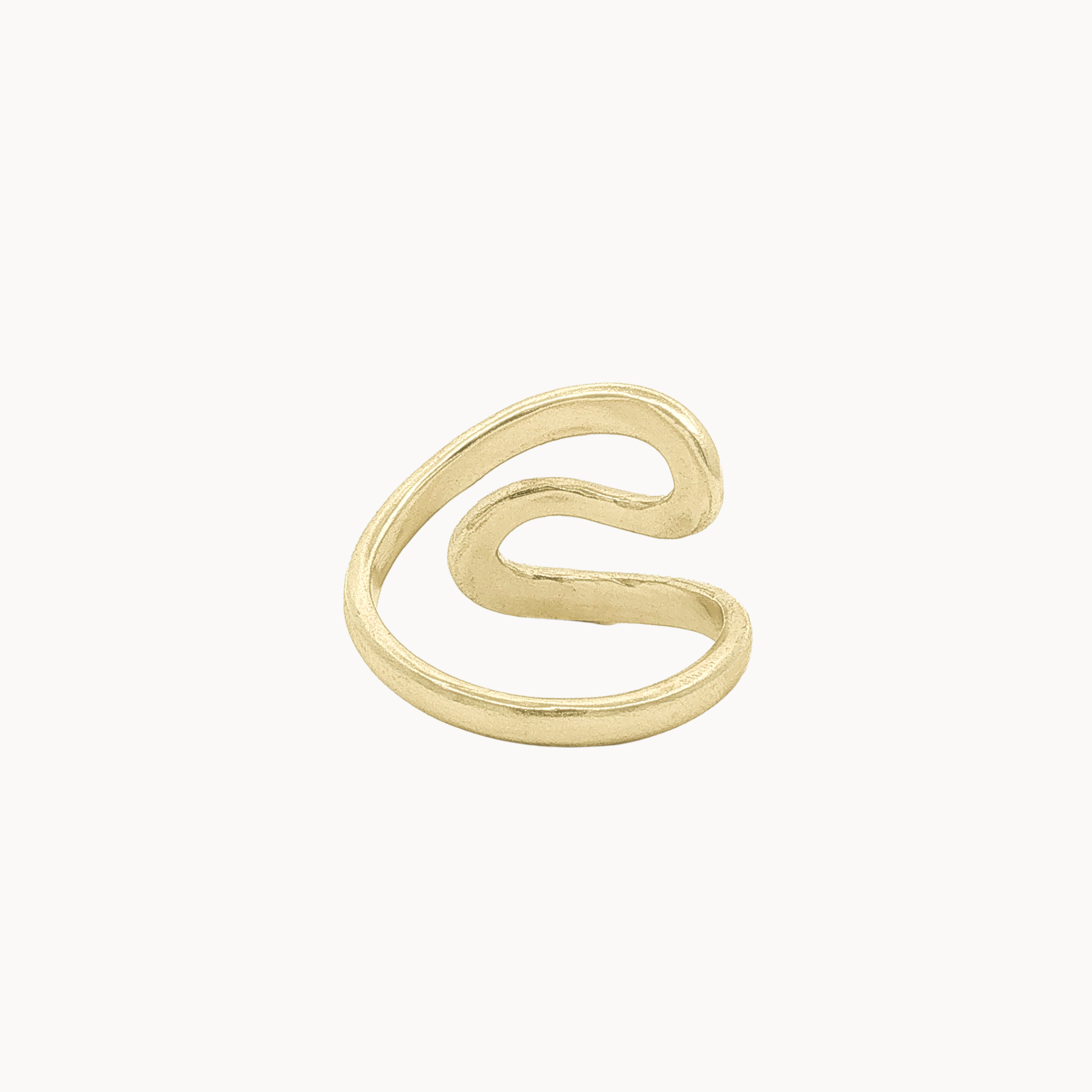 Back view of a gold wrap ring with a wavy, organic S-shaped design, shown on a plain off-white background.