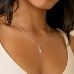 close up of silver mini sun necklace