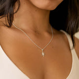 close up of silver mini sun necklace