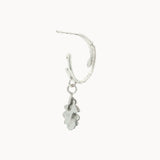 Silver hoop earring with a small dangling silver oak charm on a white background