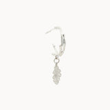 Silver leaf-shaped earring on a white background