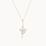 white gold four-pointed star pendant necklace with a round diamond in the middle on a white background
