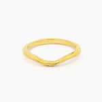 yellow gold wedding ring with soft curve shape at front and organic rustic texture on a white background
