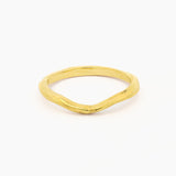 yellow gold wedding ring with soft curve shape at front and organic rustic texture on a white background