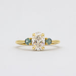 Oval Diamond and Green Tourmaline Trilogy Engagement Ring