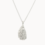 Silver pendant oyster necklace on a white background