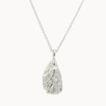 Silver pendant oyster necklace on a white background