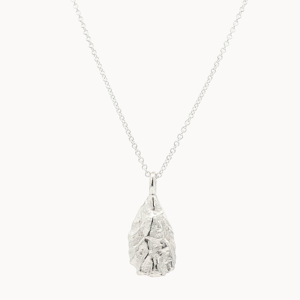 Silver oyster necklace with silver chain on a white background