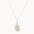 Silver oyster necklace with silver chain on a white background