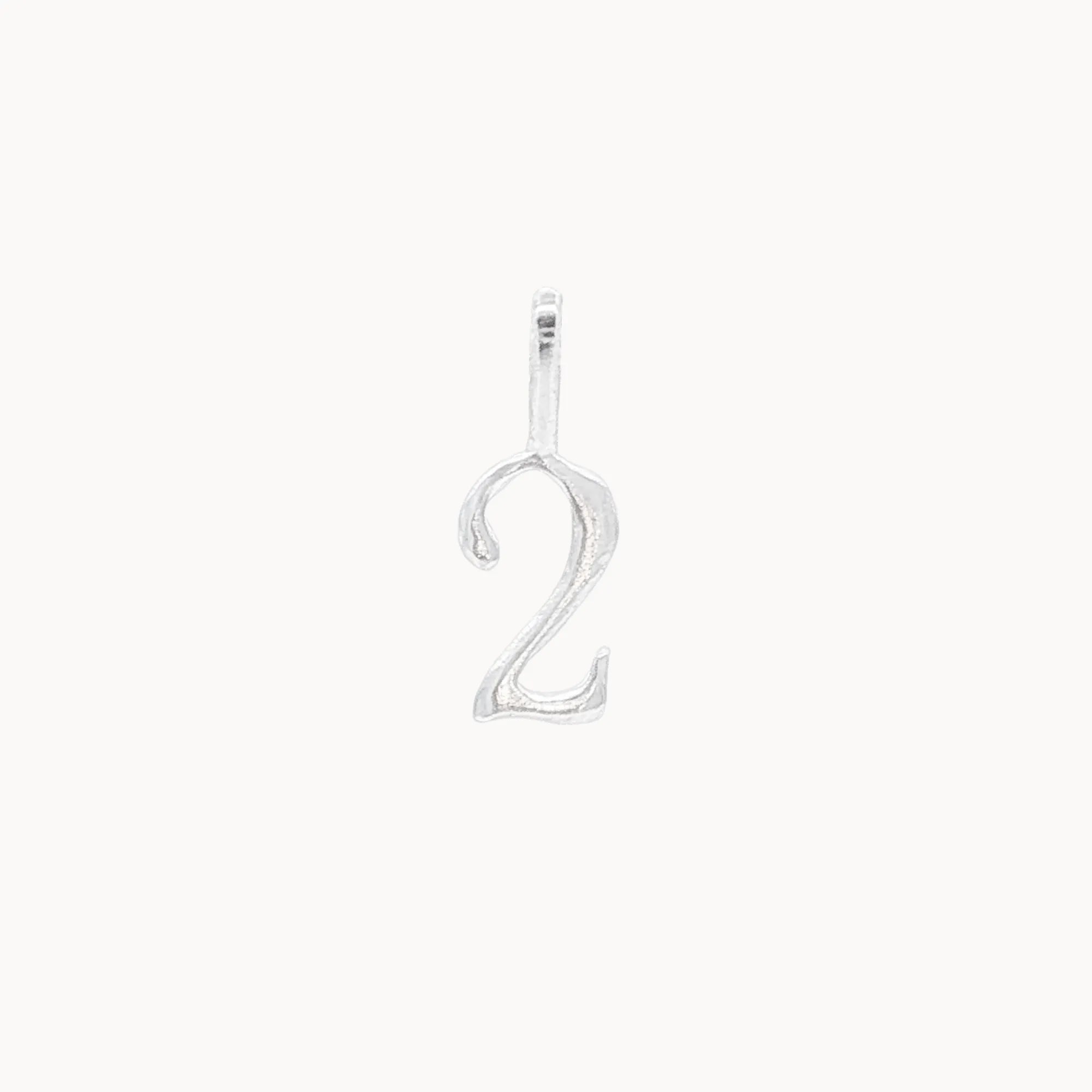 Silver number '2' pendant on a white background
