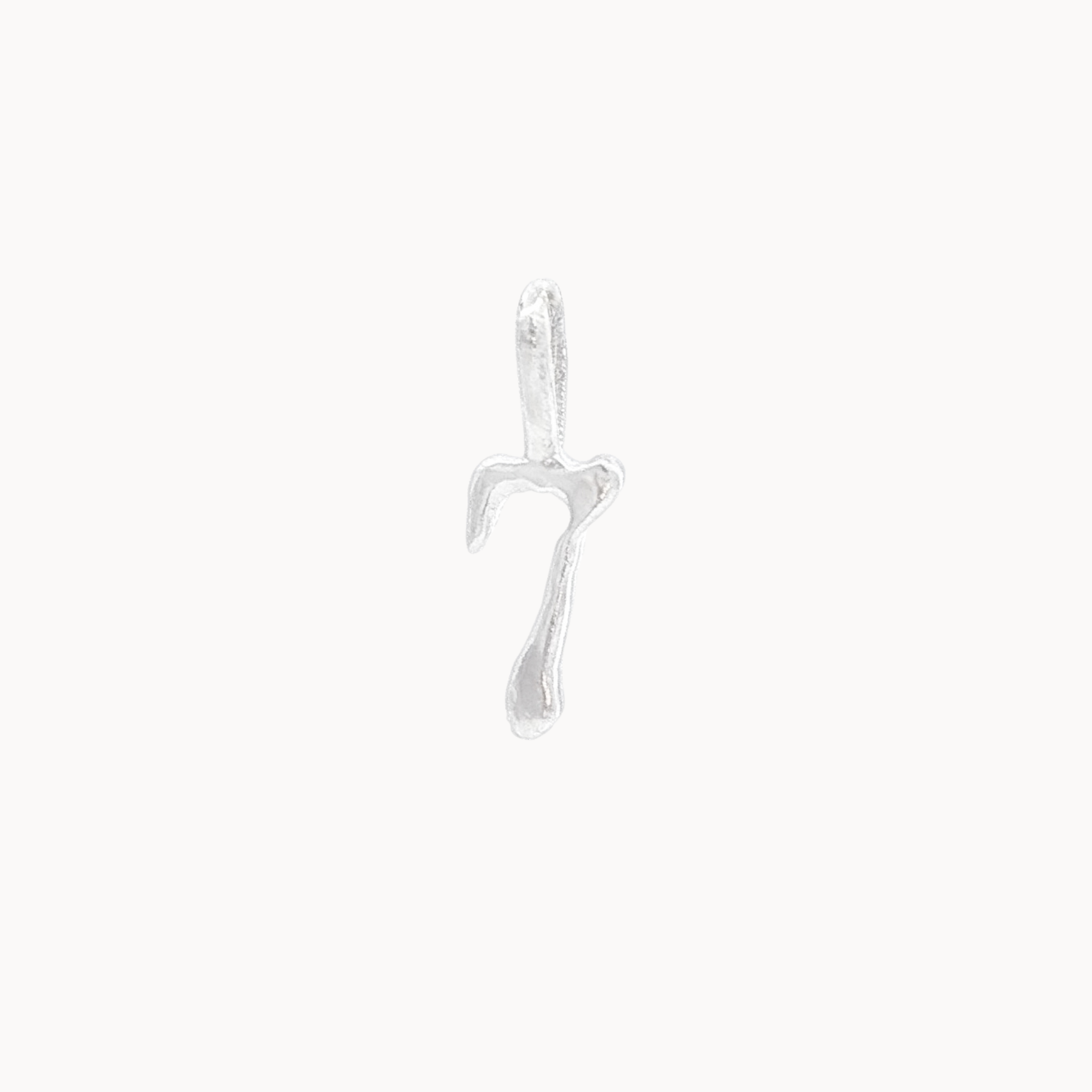 Silver seven pendant on a white background