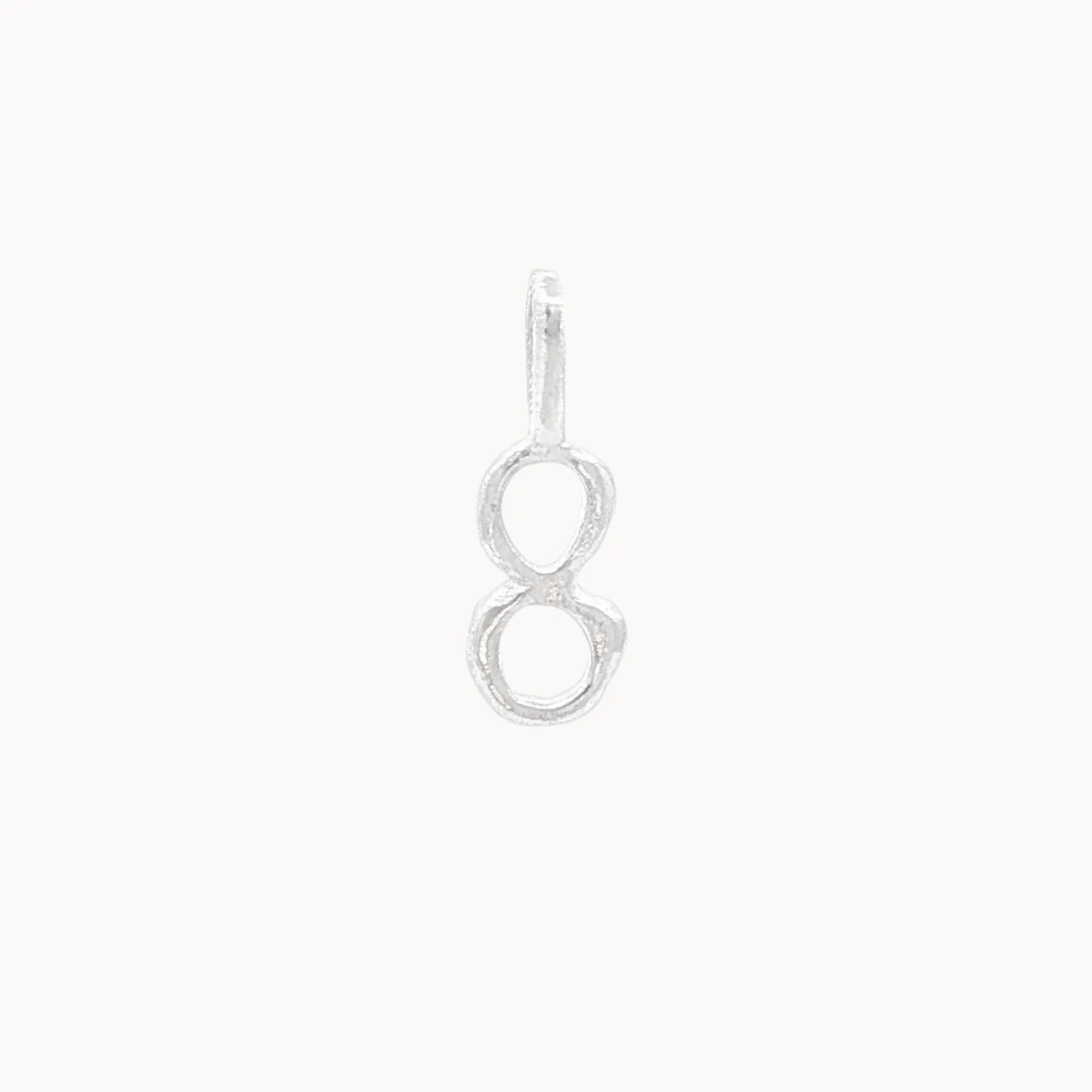 Silver number 8 pendant on a white background