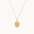 Gold pisces necklace with a pendant on a white background