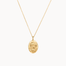 Gold pisces necklace with a pendant on a white background