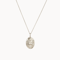 silver sagittarius necklace with oval pendant and enbossed design on a white background