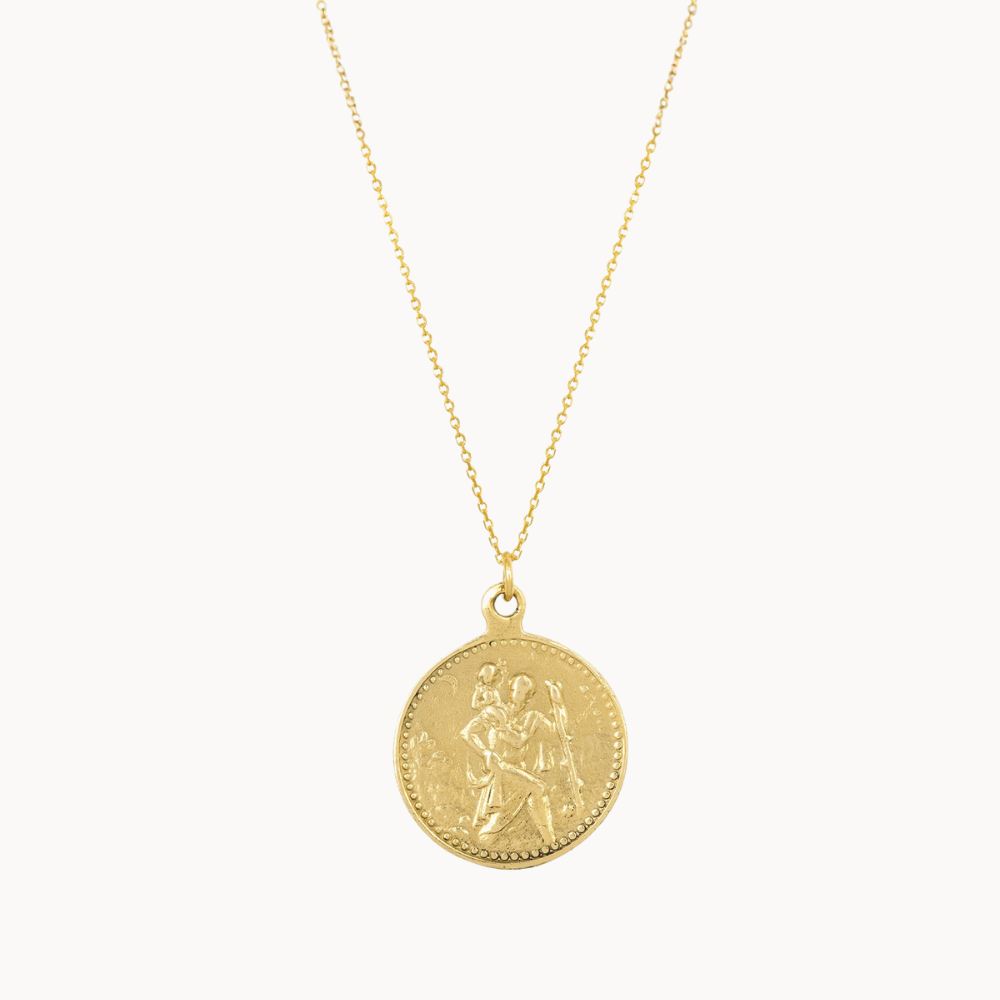 gold saint christopher necklace on a white background