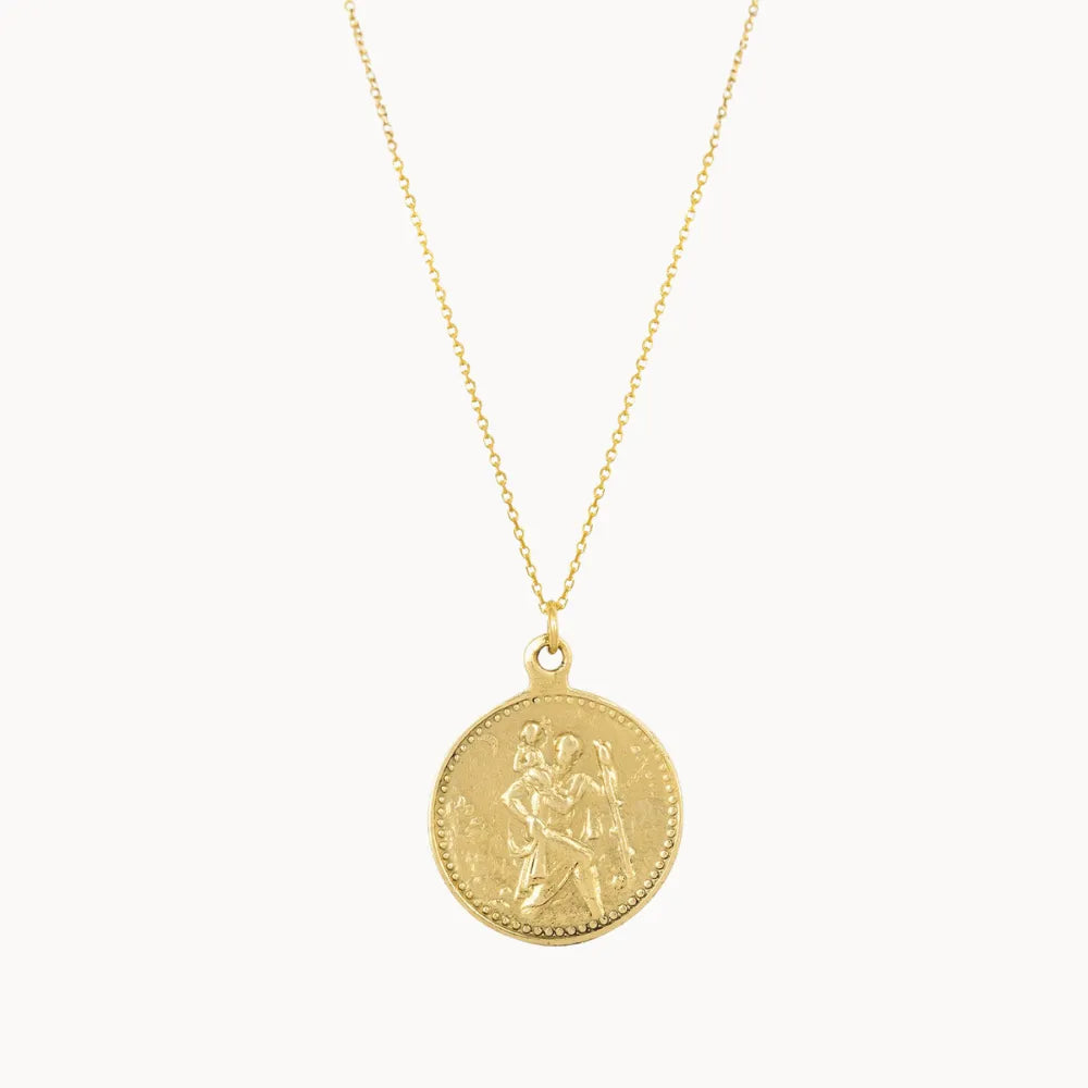gold saint christopher necklace on a white background