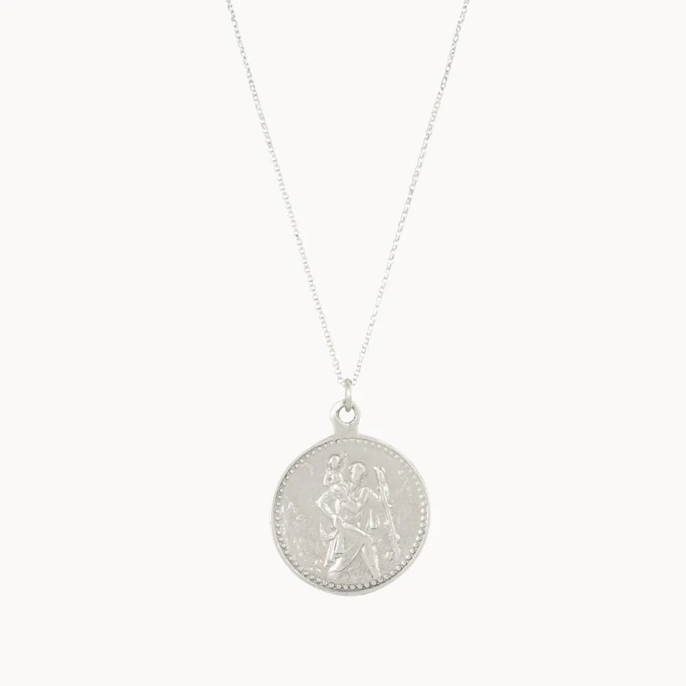 silver round pendant necklace with saint christopher design on a white background