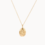 gold scorpio necklace with oval pendant on a white background