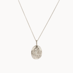 Silver scorpio necklace with a detailed oval pendant on a white background