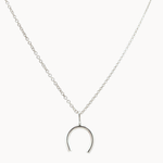 Silver wishbone horseshoe pendant necklace on a white background