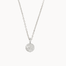 Silver necklace with a round moon and stars pendant on a white background
