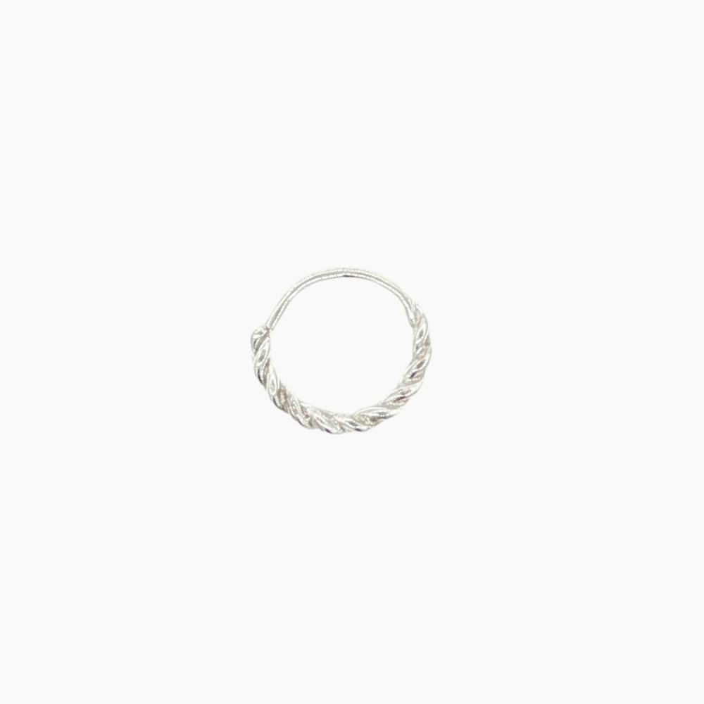 Silver helix hoop earring with a twisted design on a white background