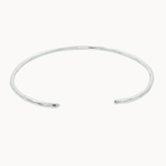slim silver open bangle with hammered texture on a white background