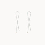 Pair of silver hoop earrings on a white background
