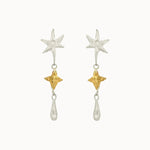 dangle earrings with silver and gold star shaped pendants on a white background