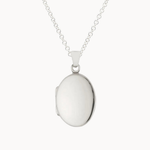 silver oval locket necklace against a white background