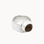 side view of a chunky silver band ring with texture and large cabocon smoky quartz stone
