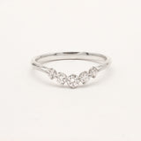 9ct white gold ring with curved diamonds on a light gray background