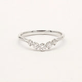 9ct white gold ring with curved diamonds on a light gray background