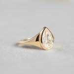 Statement Bezel Set Pear Diamond Engagement Ring