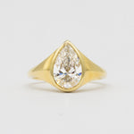 Statement Bezel Set Pear Diamond Engagement Ring
